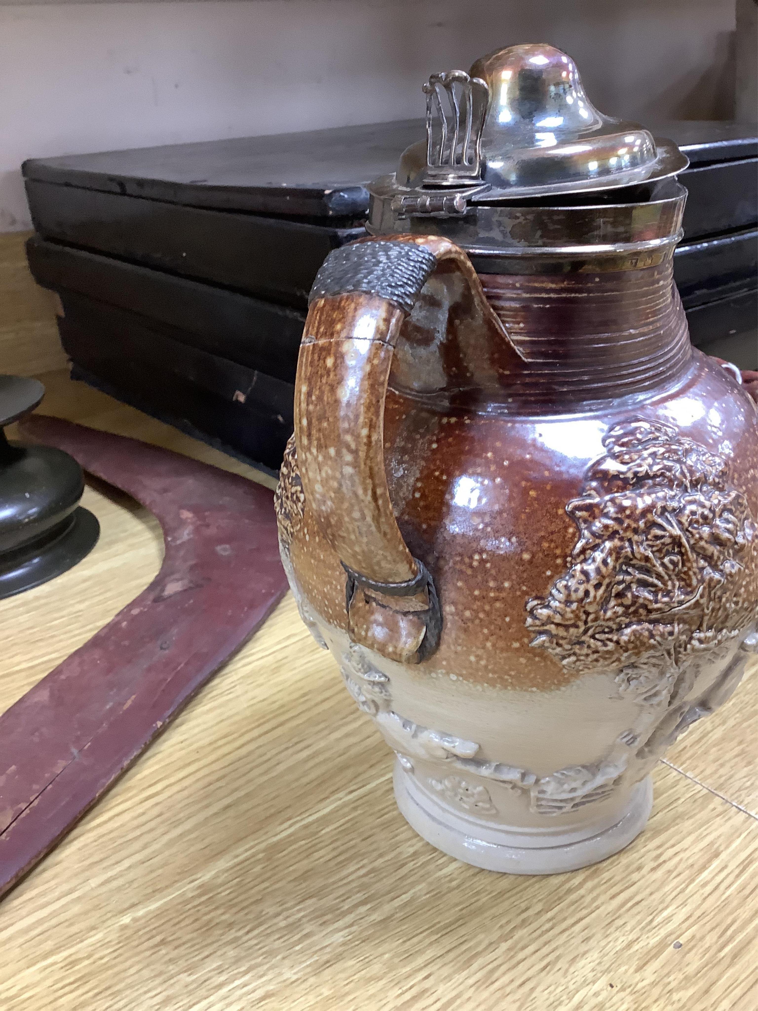 A group of Continental ceramics including two late 18th/early 19th century Italian maiolica wet drug jars, a Staffordshire Whieldon type tortoiseshell glazed plate c.1770 and a silver mounted Mortlake stoneware jug, 24cm